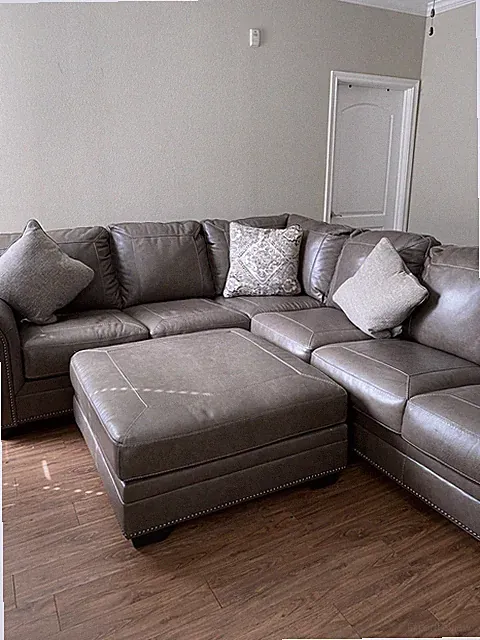100% Ashley Furniture Leather Sofa W/ Ottoman ( Pillows Included )