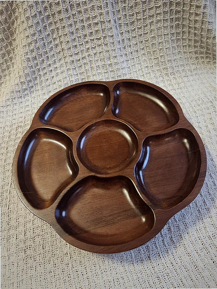 A vintage mid-century modern carved wooden seven-section divided serving tray.