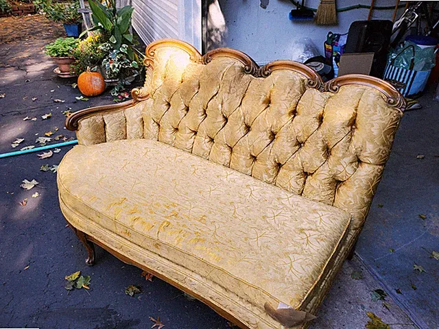 Antique Setee/Couch ORIGINAL gold colored material, curved wood, tufted back.