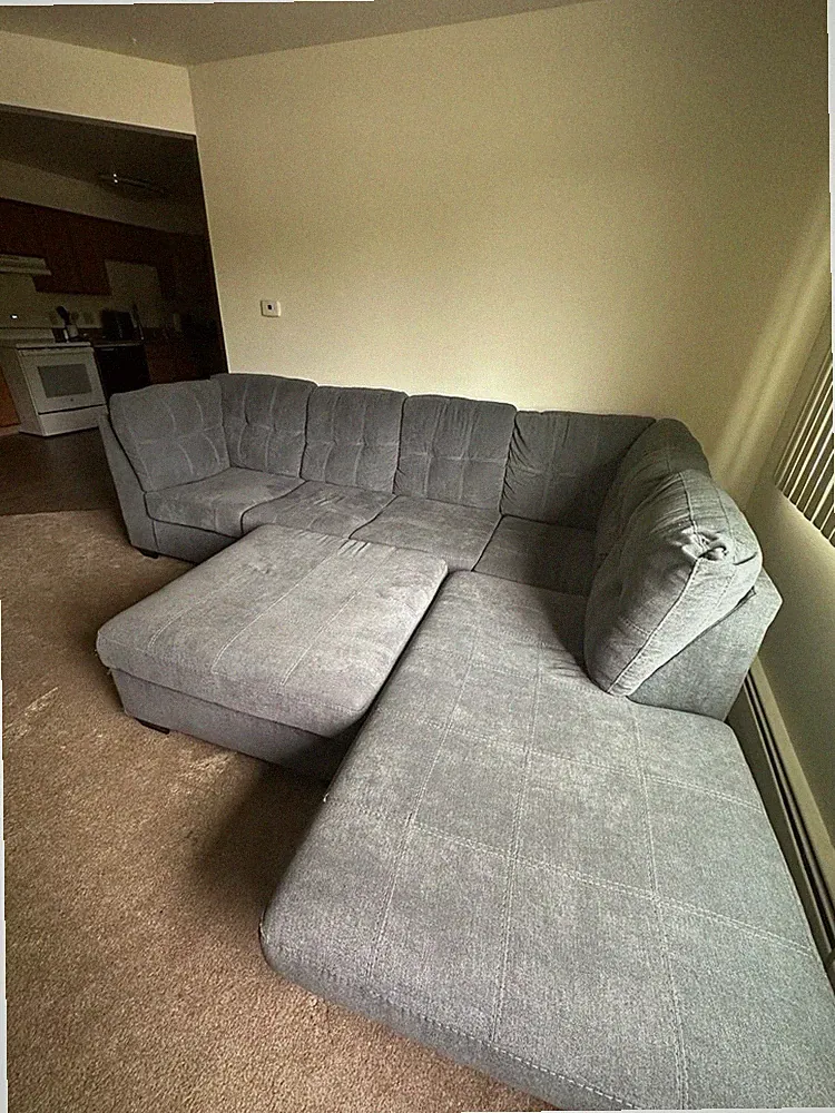 Ashley Furniture Gray Sectional Sofa with Chaise and Ottoman