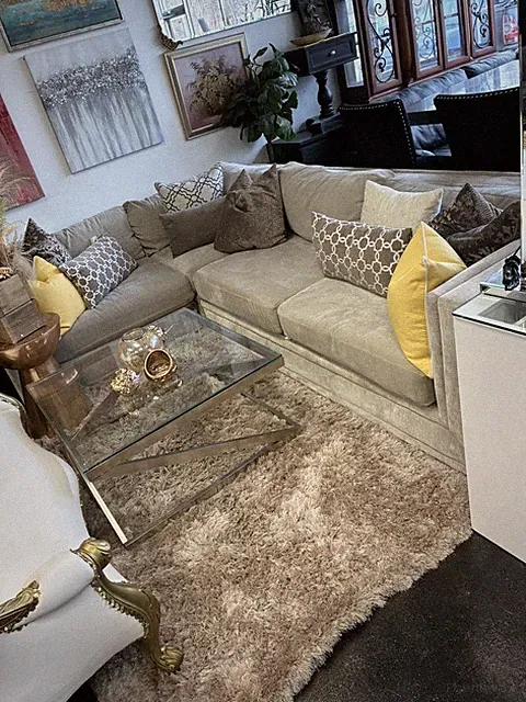Beige Corner Sectional Sofa, Geometric Yellow Pillows, Glass Coffee Table