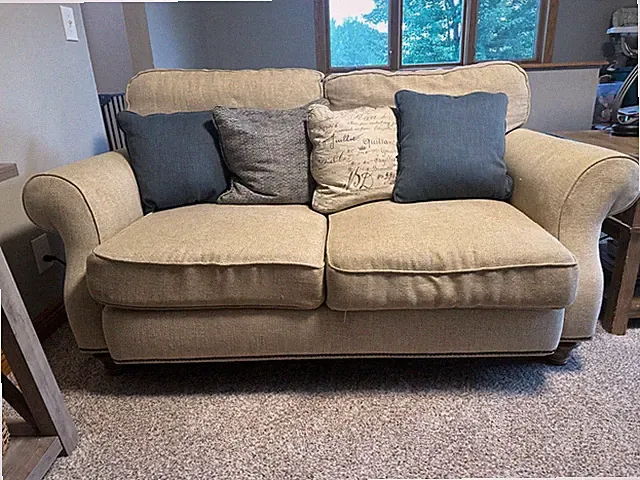 Beige loveseat sofa-used. Originally from Hennens Furniture