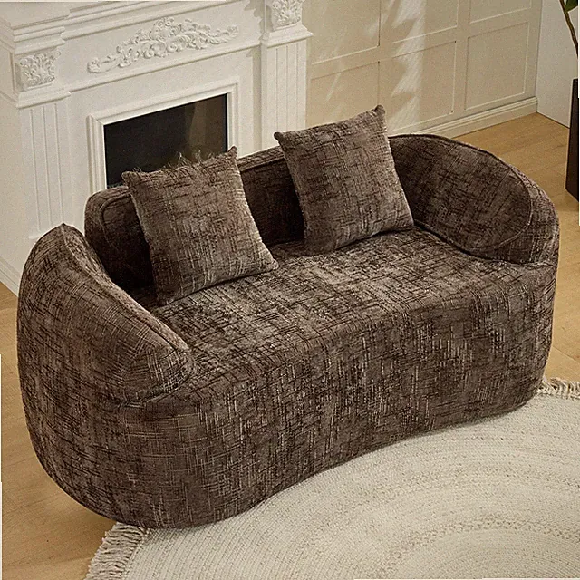 Brown curved two - person compress sofa. It has armrests on both sides, comes w