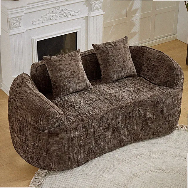 Brown curved two - person compress sofa. It has armrests on both sides, comes w