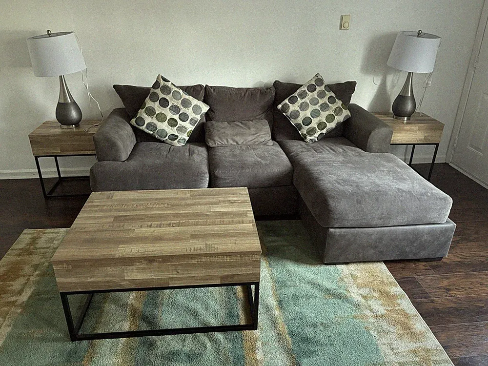 Comfy Grey Couch Sectional. Comes With Rug Table And Lamp Posts