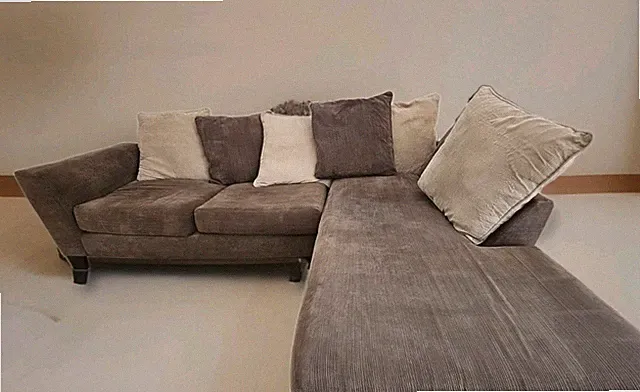 Contemporary Hunt Brothers sectional sofa with a chaise. Pre-owned