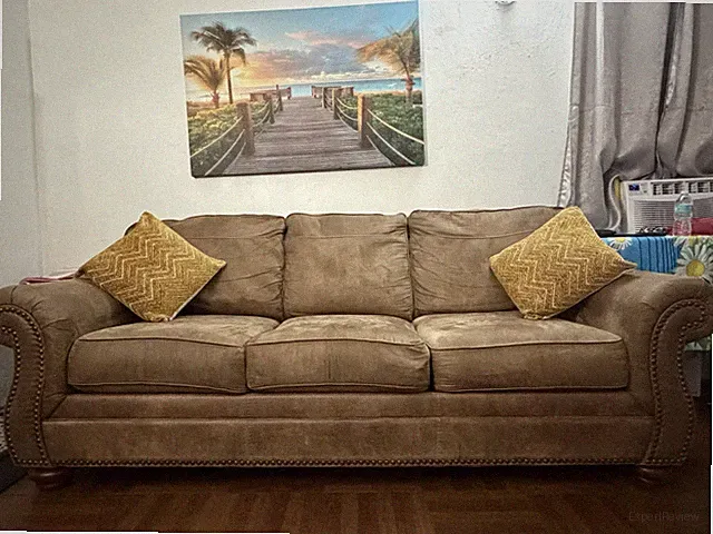 Cozy Brown Microfiber Rolled Arm 5 -Seat Sofa Nailhead Trim with cushions.