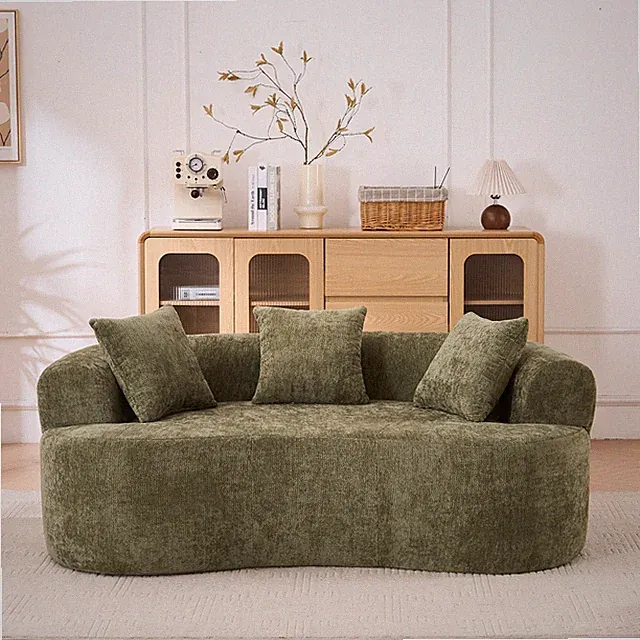 Crescent-shaped sofa, modern low-back design with deep cushions, featuring a se