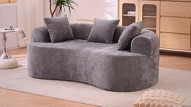 Crescent-shaped sofa, modern low-back design with deep cushions, self-inflat