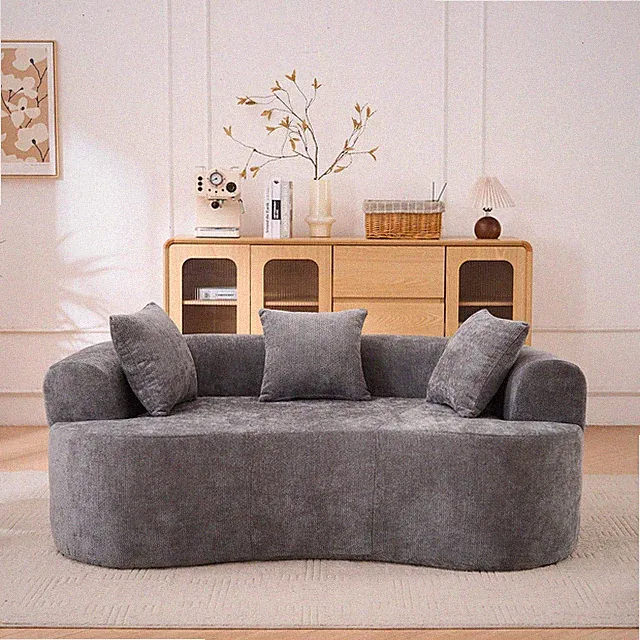 Crescent-shaped sofa, modern low-back design with deep cushions, self-inflating