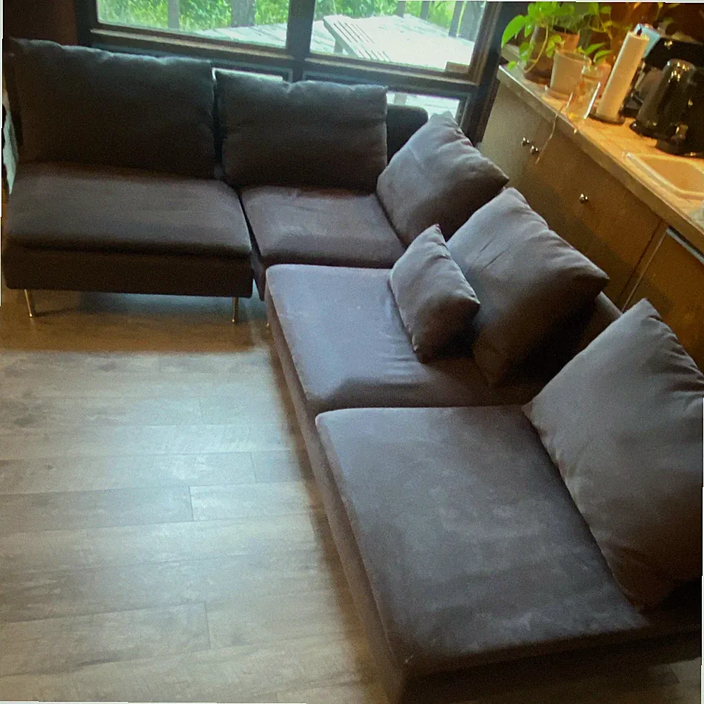 Dark Charcoal L-Shaped Sectional Sofa, Modern Metal Frame, With Cushions.