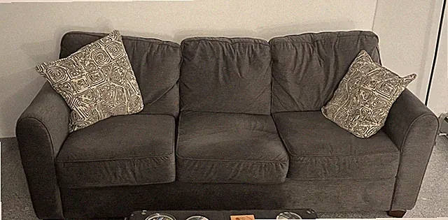 Gray 6'6"Ashley Furniture couch with 2 pillows