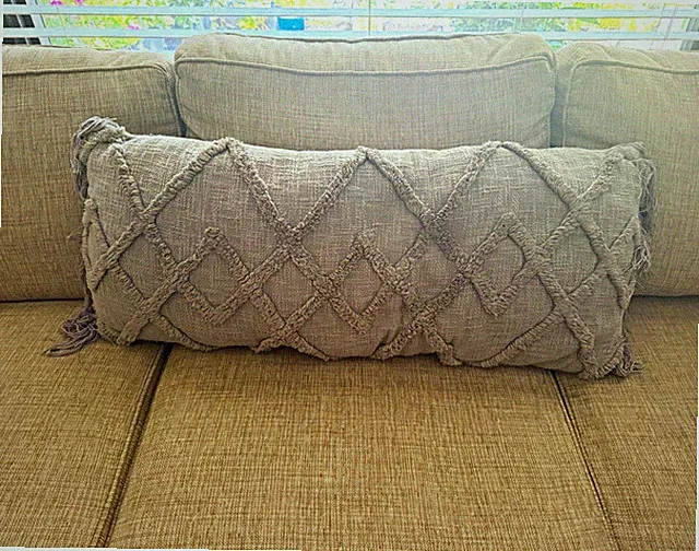 Gray lounge pillow. Good for couch or bed