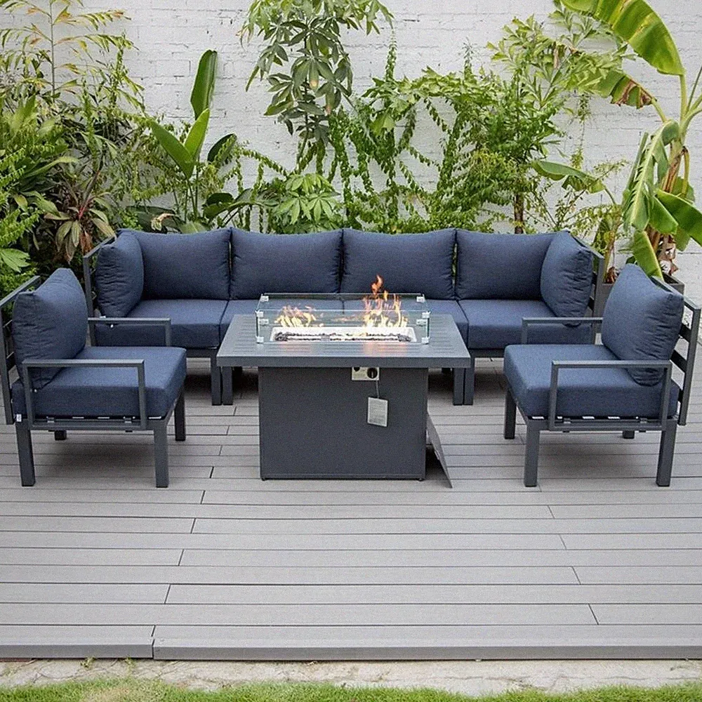 LeisureMod Chelsea 7-Piece Sectional And Fire Pit Table With Cushions in Blue