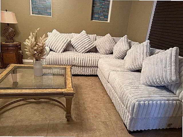 Light-grey sectional sofa in excellent condition. Soft ribbed velvet fabric