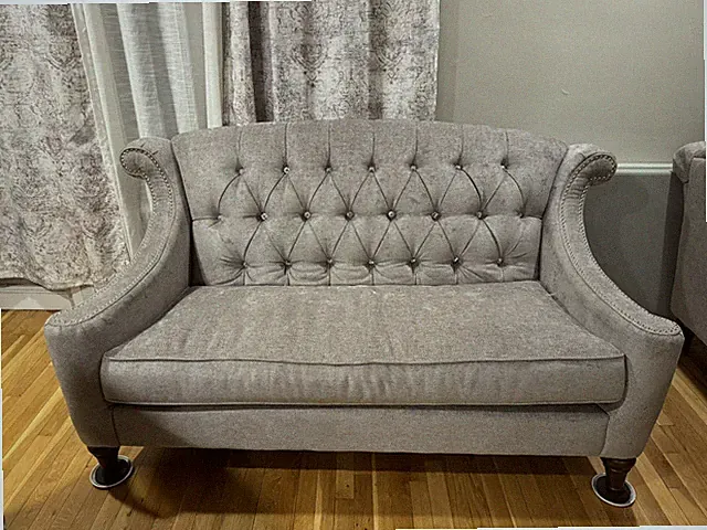 Light grey sofas/ couches.