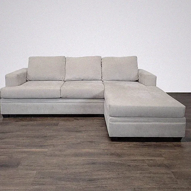 Living Spaces Beige Sectional Sofa with Chaise – Modern & Spacious