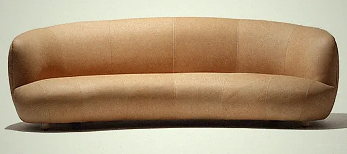 Modern Curved Tan Leather Sofa with Rounded Design