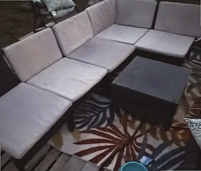 Outdoor Rattan Sectional Set with light gray Cushions, Black chairs, & glass top