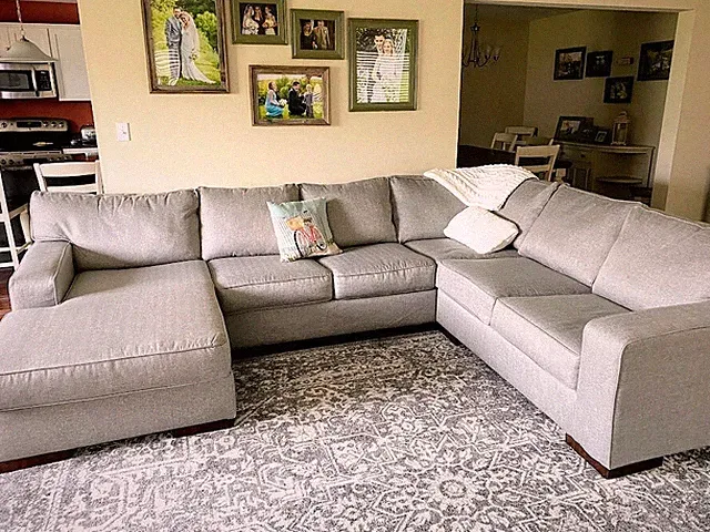 sectional sofa with chaise and ottoman. 18 months old, 130 in long