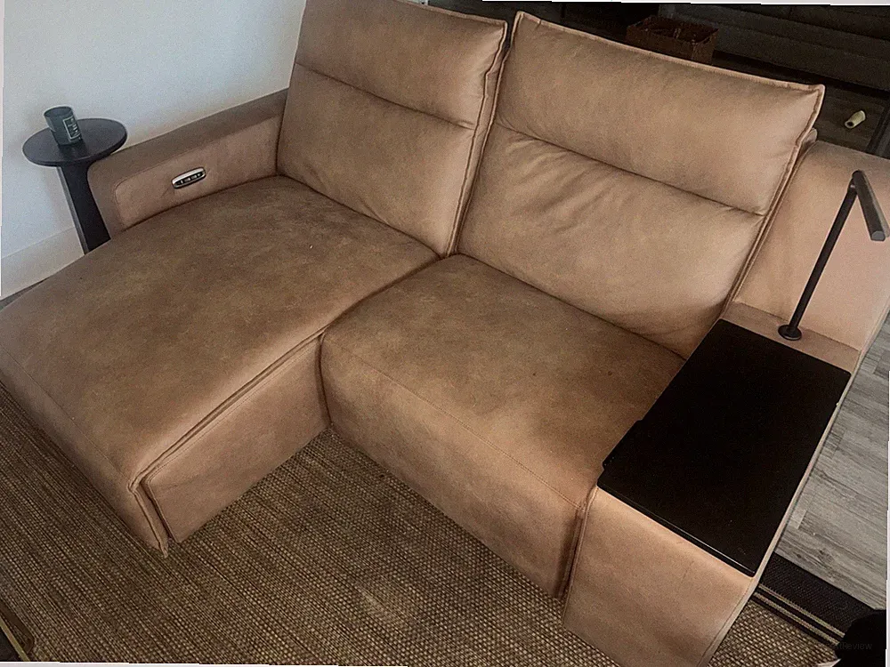 Segmented and multi-functional brown leather L sectional.