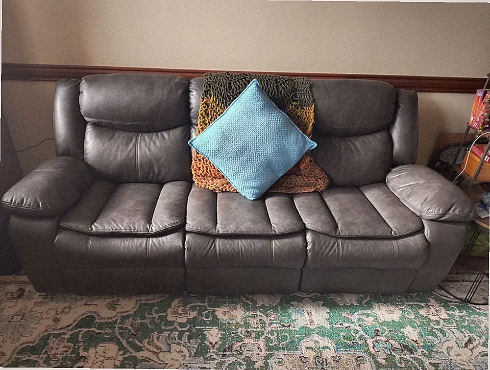 Slate Gray Ashley Reclining Couch, Faux Leather On Front Side, Leather On Back