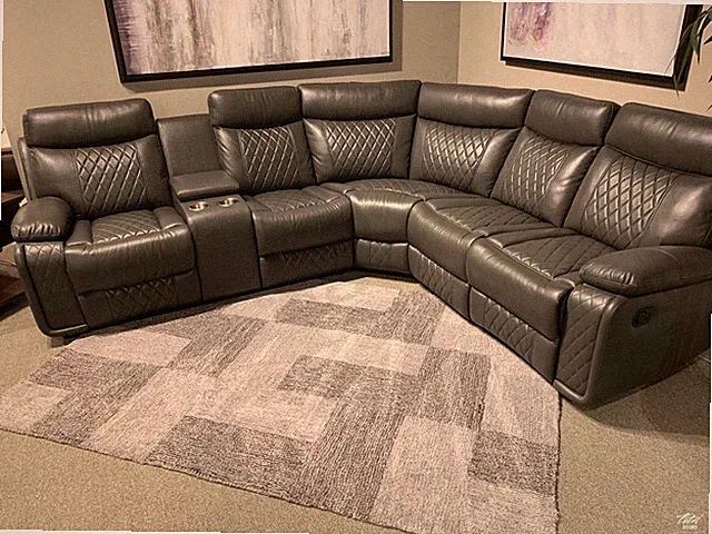 Soft grey leather reclining sectional with cup holders