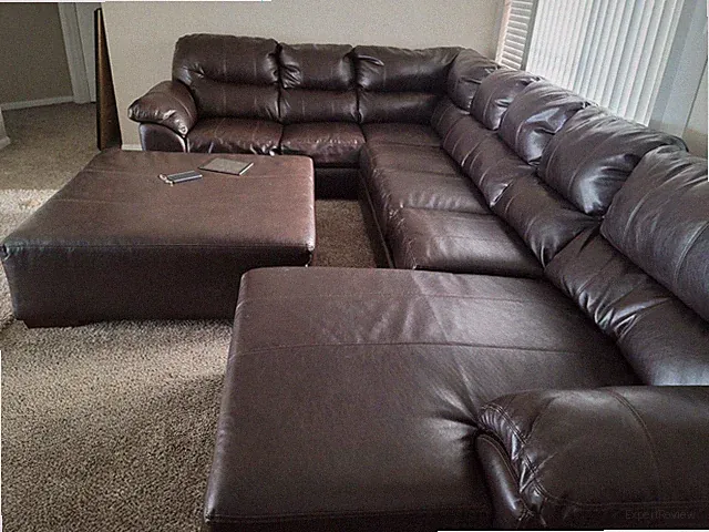 Three piece brown sectional with right side chaise lounge