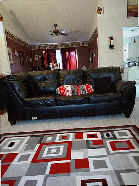 two-piece black leather sectional sofa