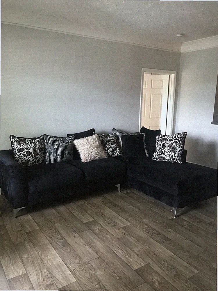 Two Piece Black Sectional Couch W/ Leopard Pillows