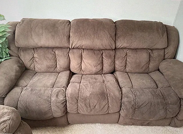 two piece sectional, dark brown and in very good condition.