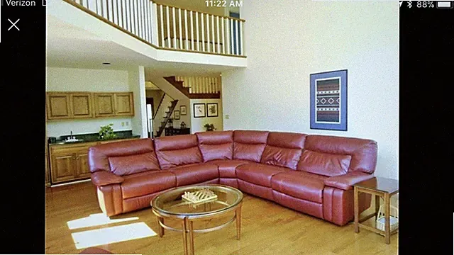 used leather sectional sofa w/two electric powered recliners on each end.