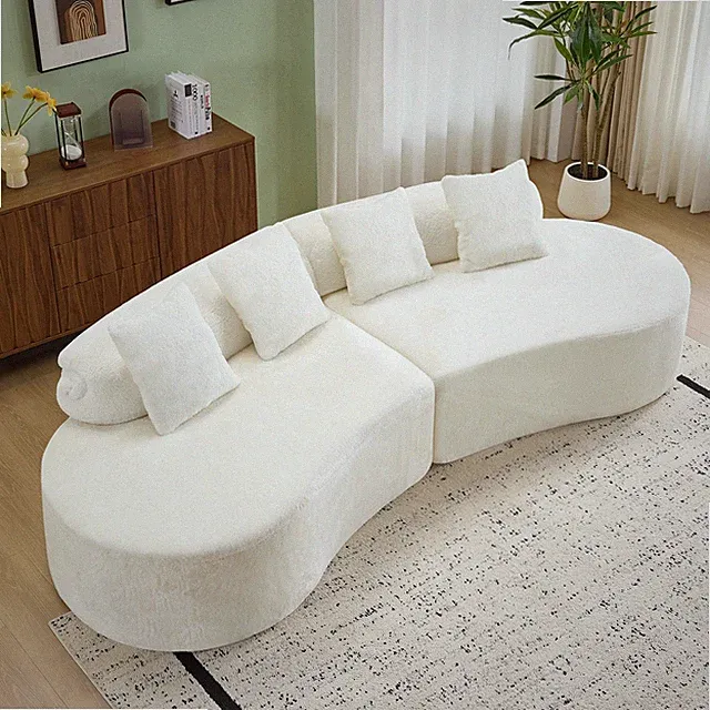 white curved multi - seater sofa. The plush and skin - friendly fabric makes it