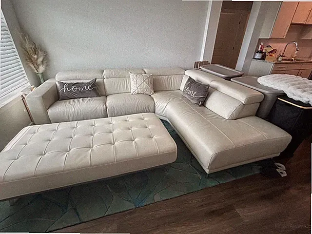 White leather sectional sofa + chaise and Ottoman
