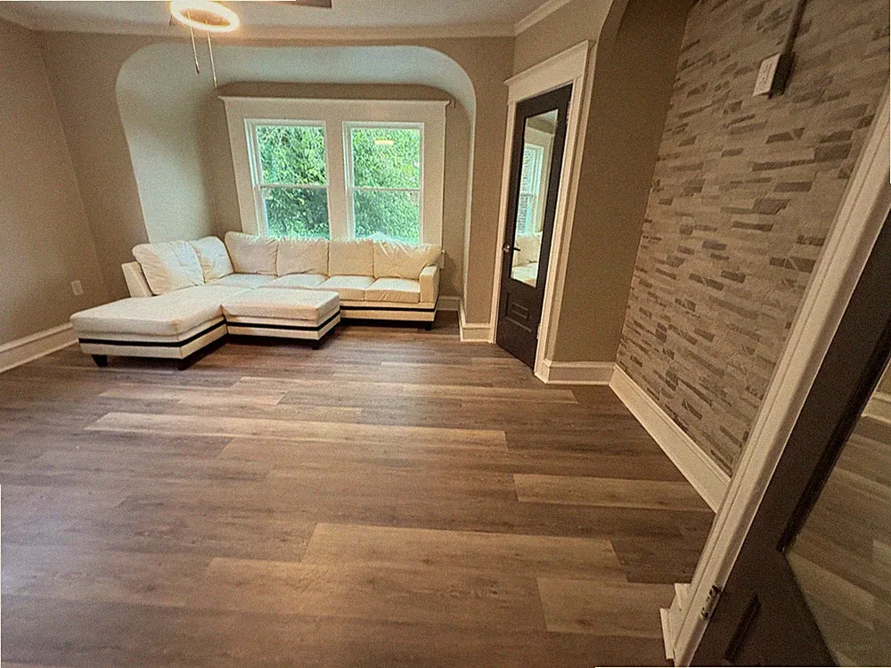 White sectional sofa used with ottoman