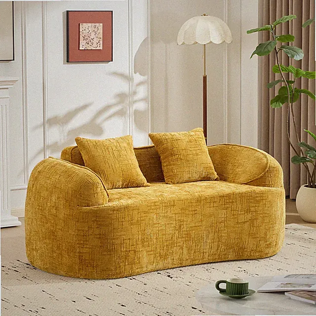 Yellow curved two - person compress sofa. It has armrests on both sides, comes